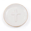 White plate with a cross design on a white background
